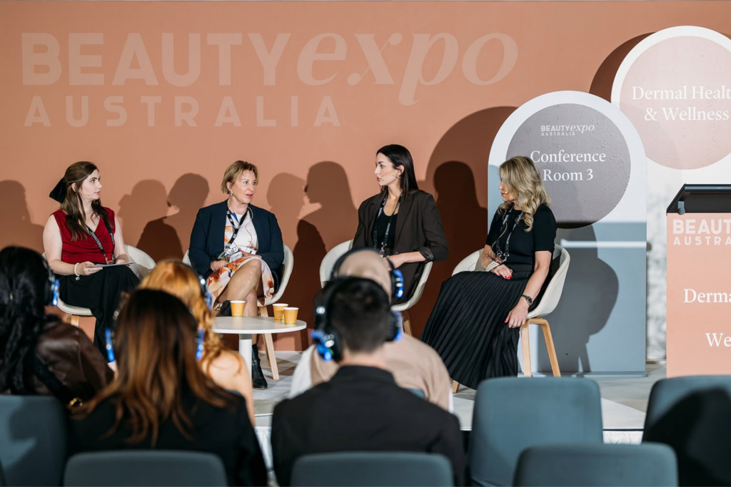 Panel discussion taking place at Beauty Expo Australia with attendees listening