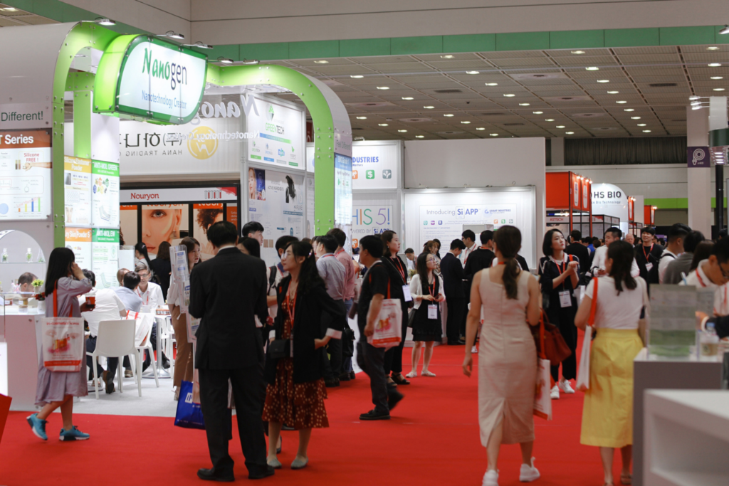 Attendees exploring exhibitor booths at In-Cosmetics Korea