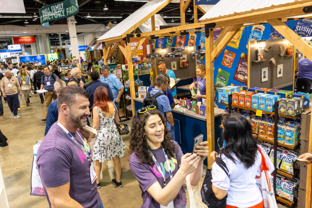 Newtopia Now attendees exploring product booths and displays