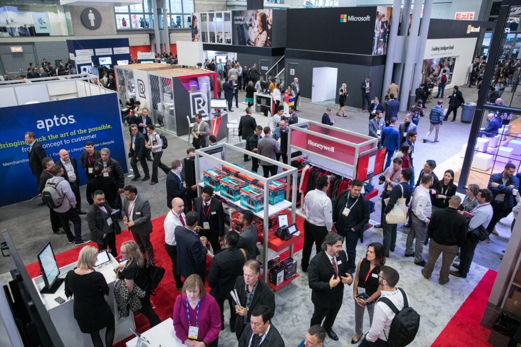 Attendees walking through exhibitor booths at NRF Conference