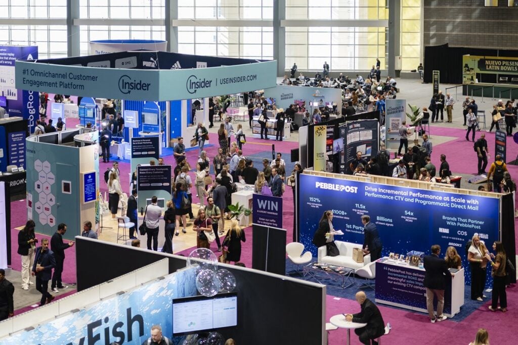 Attendees exploring exhibitor booths at Shoptalk Fall